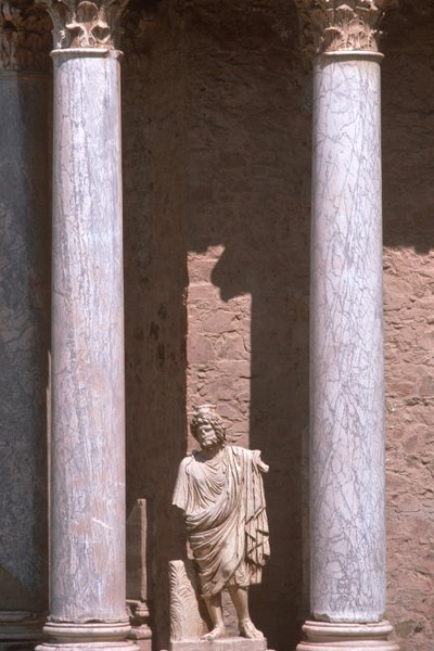 A statue between two columns by Roman